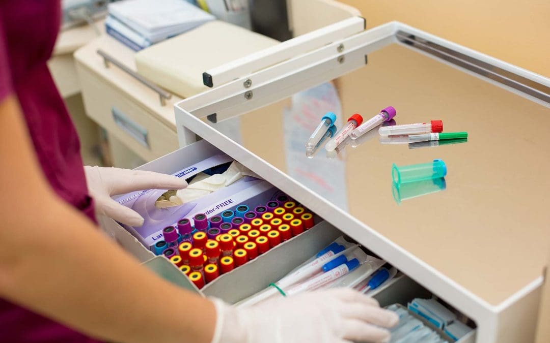 A lab assistant organizing and labelling samples during the Medical Laboratory Assistant Program